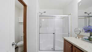 Full bathroom with a shower stall and vanity