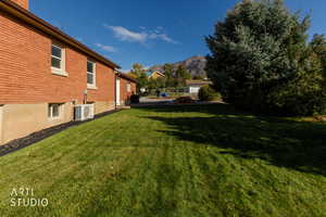 View of grassy yard featuring a mountain view