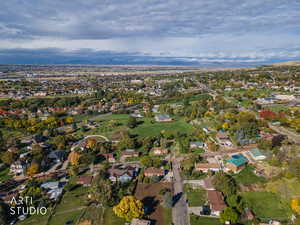 Aerial overview of property's location featuring nearby suburban area