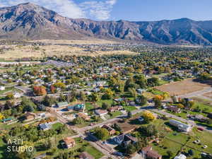View of property location featuring nearby suburban area and a mountain backdrop