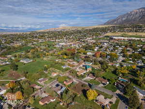 Aerial overview of property's location featuring nearby suburban area and a mountain backdrop
