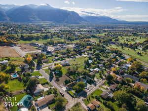 View of property location featuring a mountain backdrop and nearby suburban area