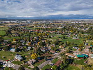 Aerial overview of property's location featuring nearby suburban area