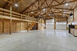 Garage featuring freestanding refrigerator