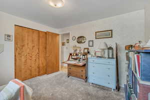 3rd upstairs bedroom with carpet and a closet