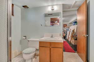Full bathroom featuring vanity and toilet