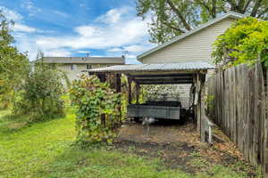 View of yard featuring a covered trailer park.