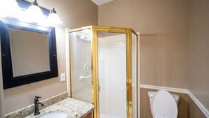 Bathroom with a shower stall and vanity