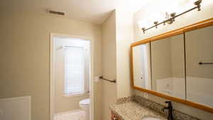 Bathroom with vanity and toilet