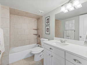 Full bathroom with  shower combination, vanity, and light tile patterned floors