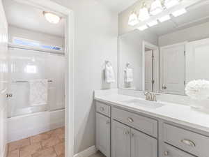 Full bathroom with vanity, bathtub / shower combination, and light tile patterned floors