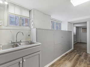 Kitchen with light countertops and light wood-style floors