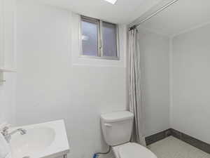 Bathroom featuring a stall shower and vanity