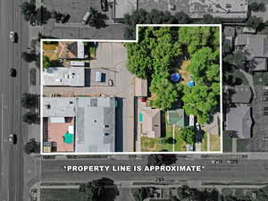 Aerial view of residential area featuring property boundaries highlighted