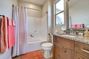Full bath with shower / bath combo and vanity