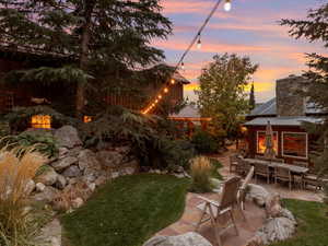 View of yard with a patio and outdoor dining area
