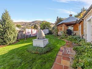 View of yard with a patio area, a mountain view, and a gazebo