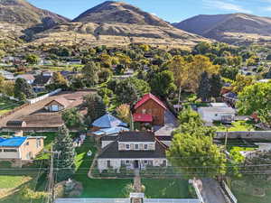 Aerial perspective of suburban area featuring a mountainous background