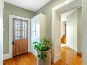 Entryway with hardwood / wood-style flooring to side porch