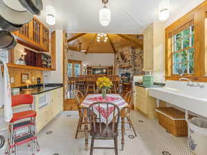 Dining area featuring wood ceiling and a chandelier