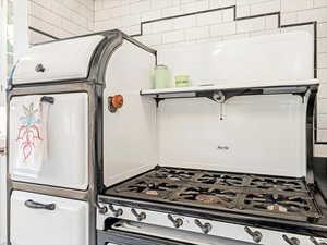 Kitchen with range with gas stovetop