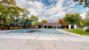 View of swimming pool featuring a patio