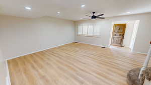 Empty room featuring recessed lighting, light wood-style flooring, and ceiling fan