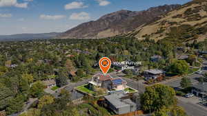 Aerial view of residential area with mountains