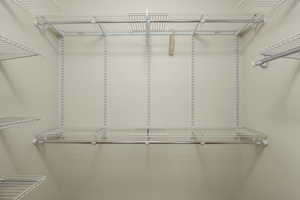 Primary Bedroom Walk in closet #2 featuring light hardwood flooring