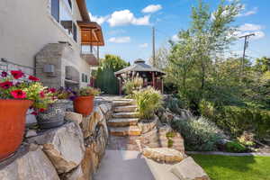 View of yard with a gazebo and a patio