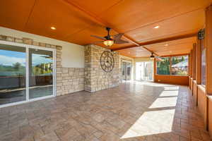 Sunroom with a ceiling fan