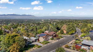 Aerial perspective of suburban area with a mountain backdrop
