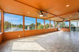 Sunroom with recessed lighting, stone tile floors, and mini split type heater/cooler