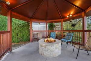 View of patio / terrace featuring a gazebo and an outdoor fire pit