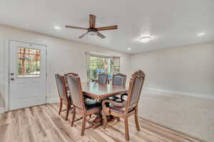 Dining area with a ceiling fan, light wood finished floors, and recessed lighting