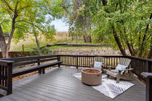 Wooden deck with an outdoor fire pit