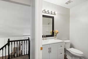 Bathroom with vanity and toilet