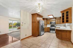 Kitchen with plenty of cabinetry and stainless steel appliances