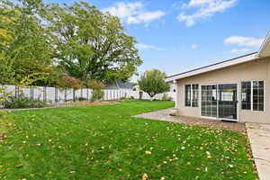 Fenced backyard featuring a patio area