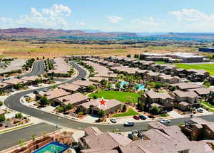 Aerial perspective of suburban area featuring a mountain backdrop