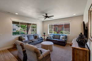 Living room featuring ceiling fan, healthy amount of natural light, and recessed lighting