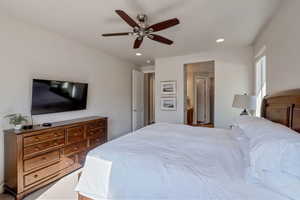 Bedroom featuring a ceiling fan, recessed lighting, and light colored carpet