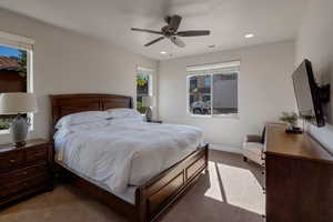 Bedroom featuring carpet flooring, recessed lighting, and a ceiling fan