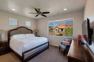 Bedroom featuring a ceiling fan, recessed lighting, and carpet floors