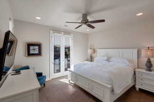 Bedroom with dark carpet, access to exterior, a ceiling fan, recessed lighting, and french doors