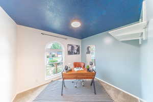 Carpeted bedroom/office space main floor