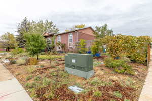 View of side of property with brick siding