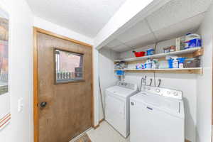 Laundry room featuring washing machine and dryer