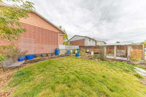 View of yard with self watering planters