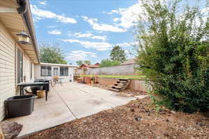 Fenced backyard featuring a patio area